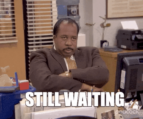Animated Still Waiting meme representing async delays in remote team communication